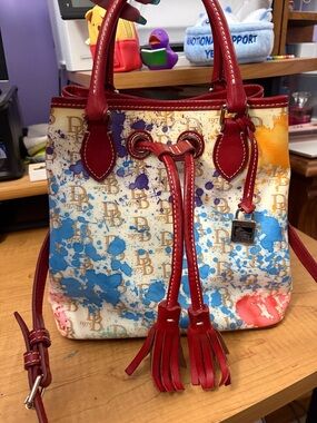 Dooney & Bourke Red Trim Signature Splash-Print Drawstring Satchel